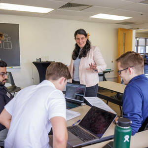 Ravit Dotan (TechBetter) works with students on calculating the ROI of AI Ethics during the recent Tech Ethics Lab Hackathon.