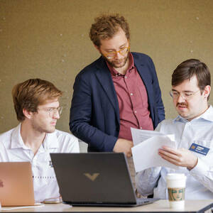 Nuno Moniz works with students during the recent Tech Ethics Lab Hackathon.