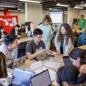 Students work on calculating the ROI of AI Ethics during the recent Tech Ethics Lab Hackathon.